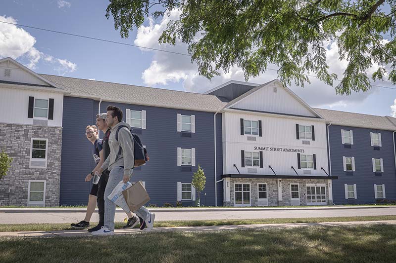 Summit Street Apartments with students walking