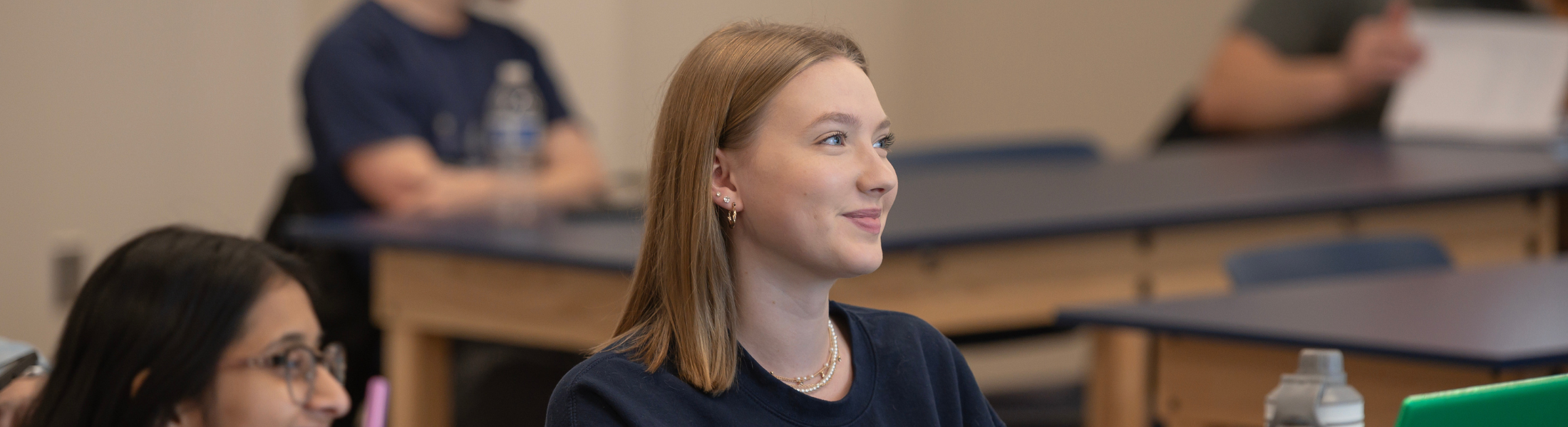 student smiling while in class