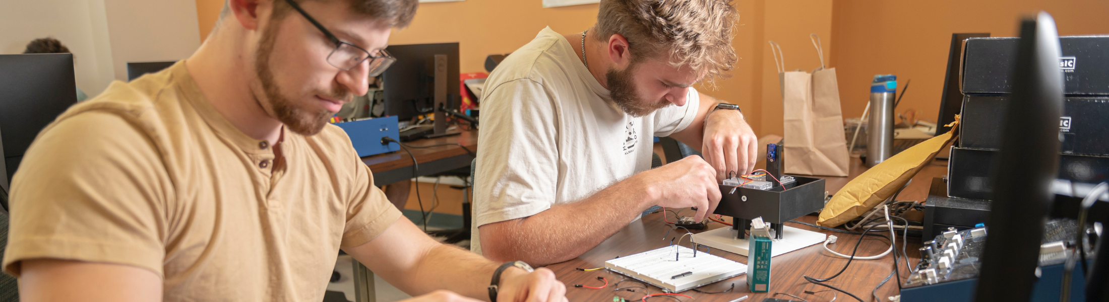two students work on computers