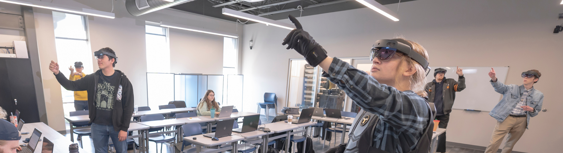 students learning with virtual reality headsets