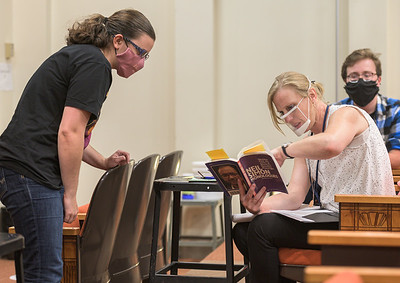 Theater director instructing student. 