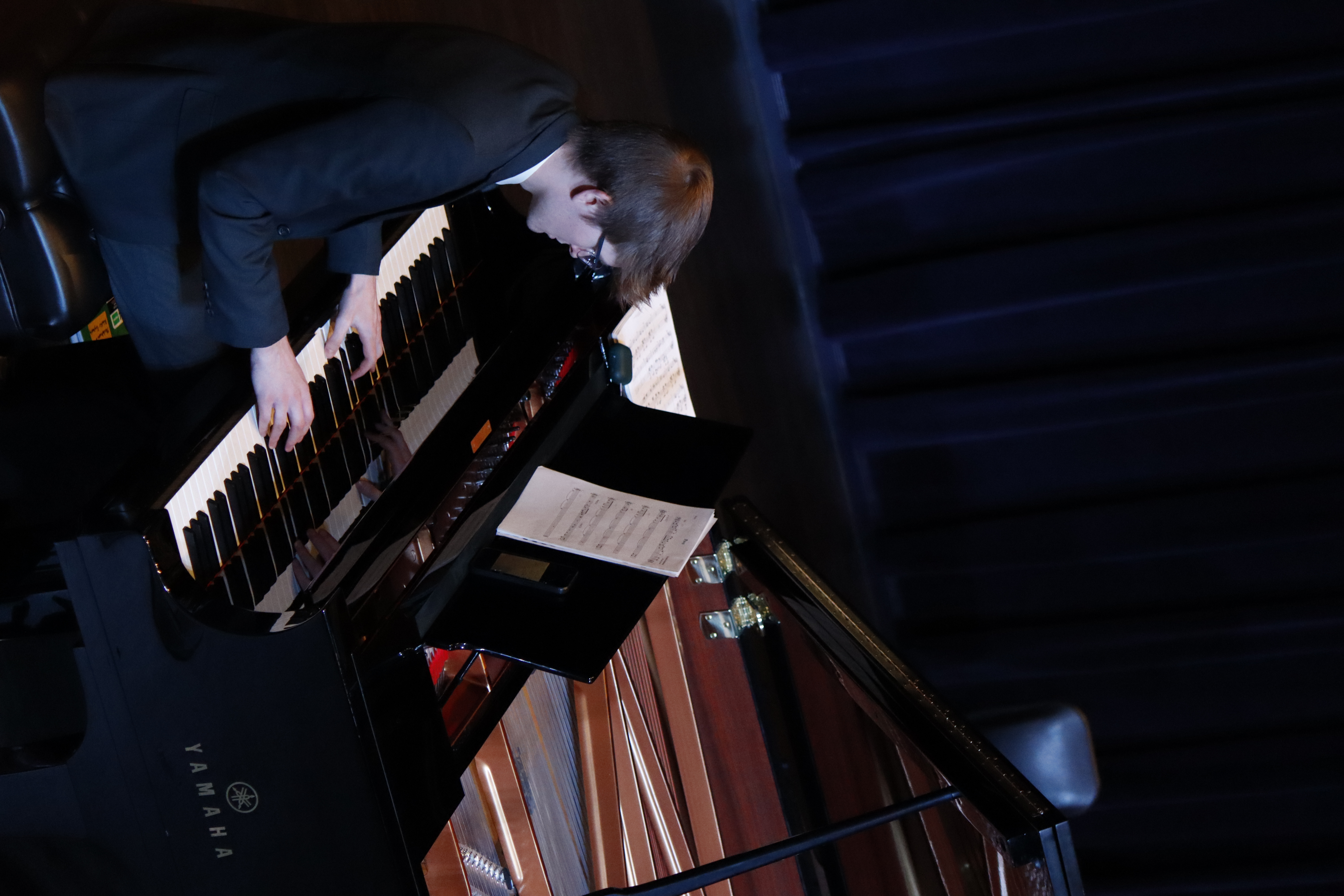 student playing the piano at a jazz concert