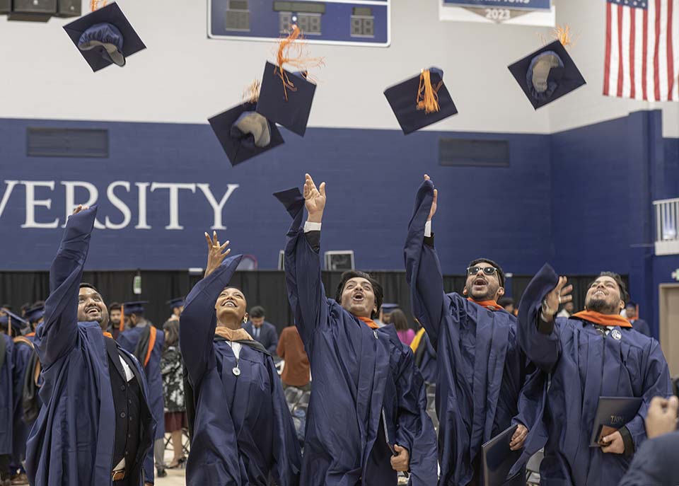 Graduates toss caps