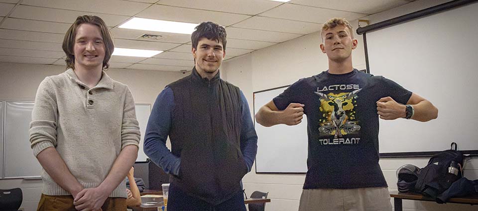 Three students standing