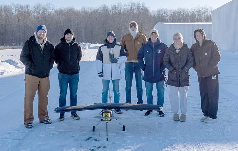 Design Build Fly team with plane