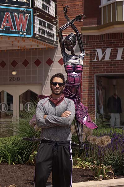 Greg Mendez with sculpture