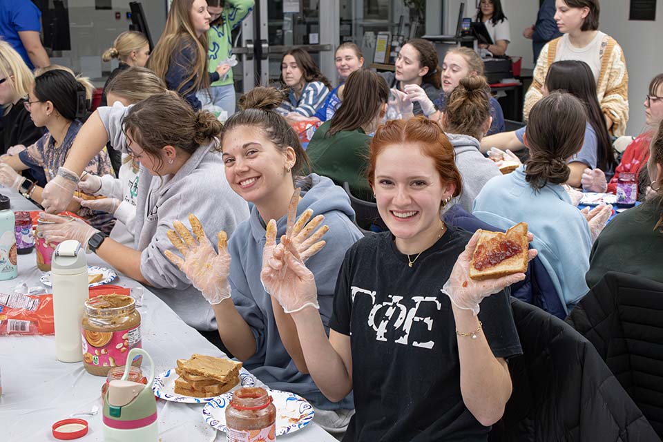 Students making PBJ sandwiches