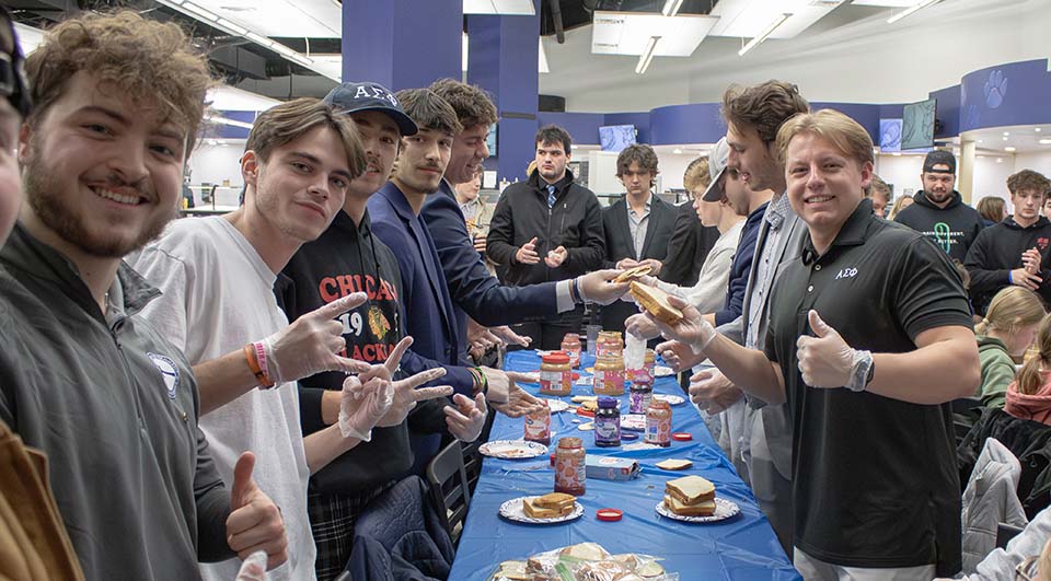 Students making PBJ sandwiches