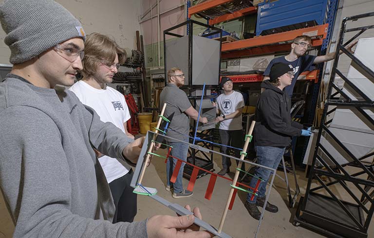 Design Build Fly team with aircraft