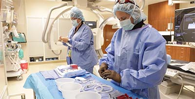 Surgical technologists in operating room