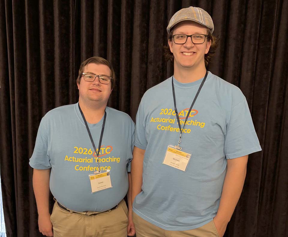 Steven Donovan and Michael Smith in conference T-shirts