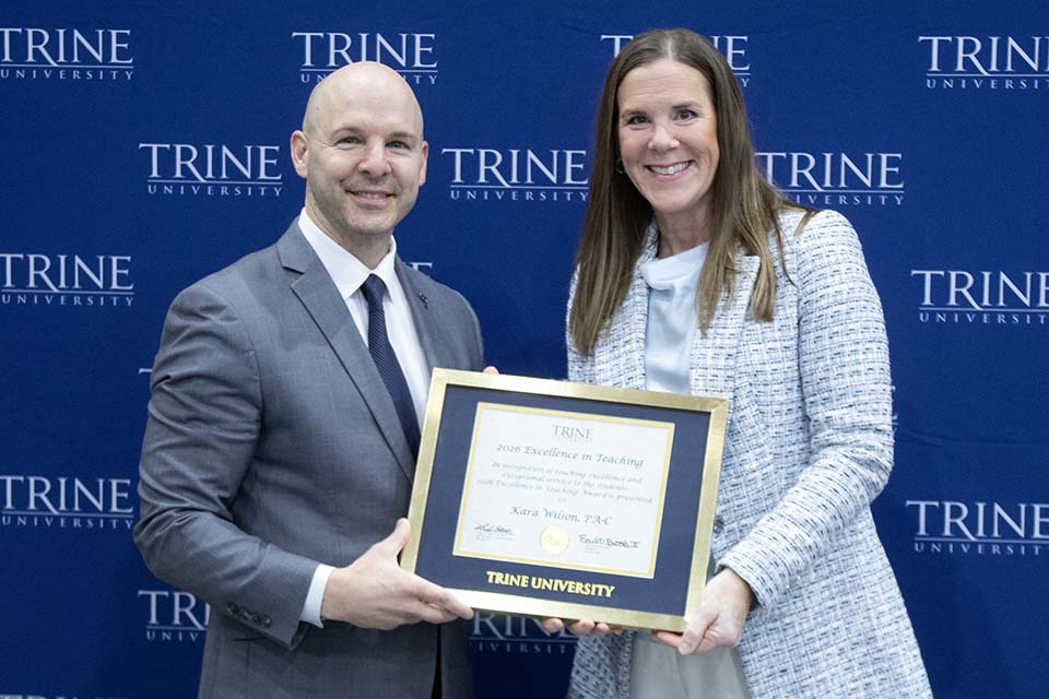 Dr. Kline presents award to Kara Wilson