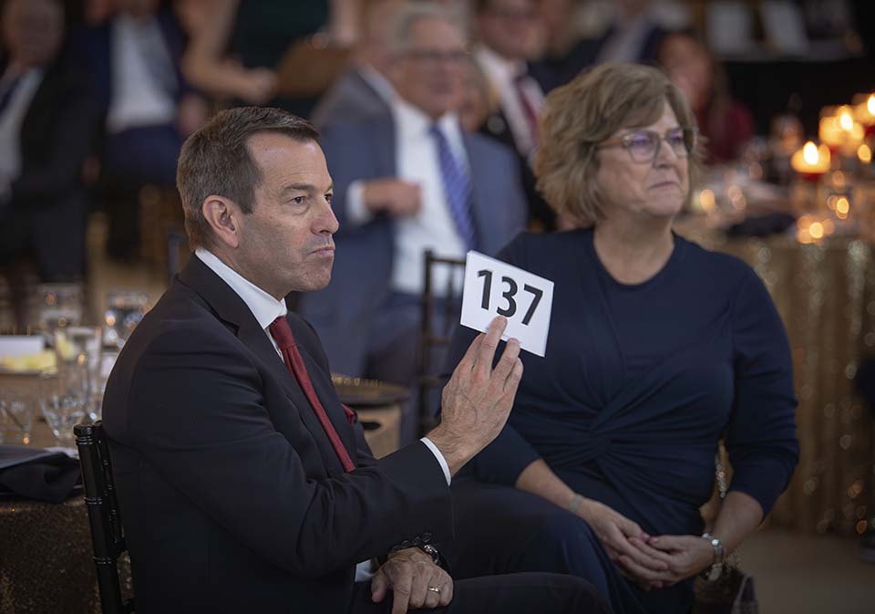 Mike and Natalie Axel bid at the live auction