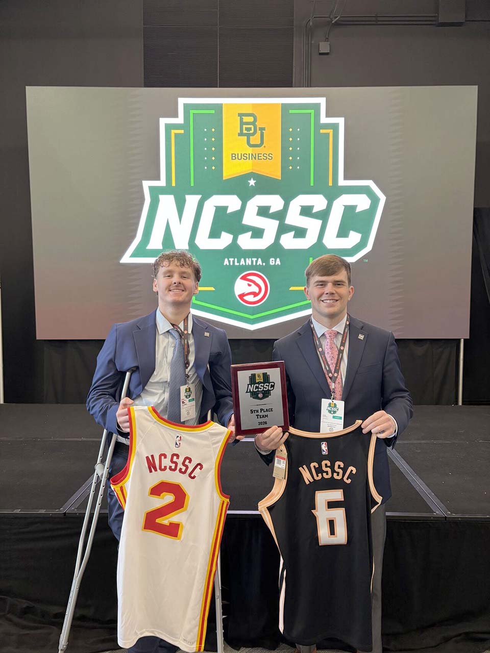 Two students with jerseys from NCSSC