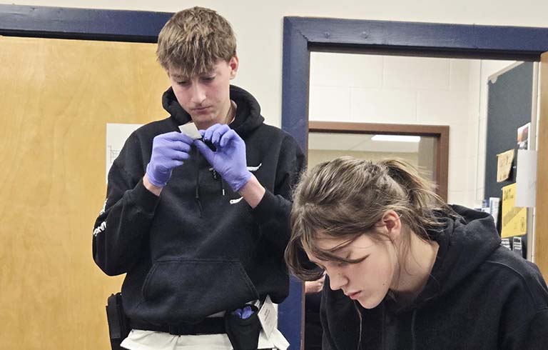 Students playing the role of crime scene technicians