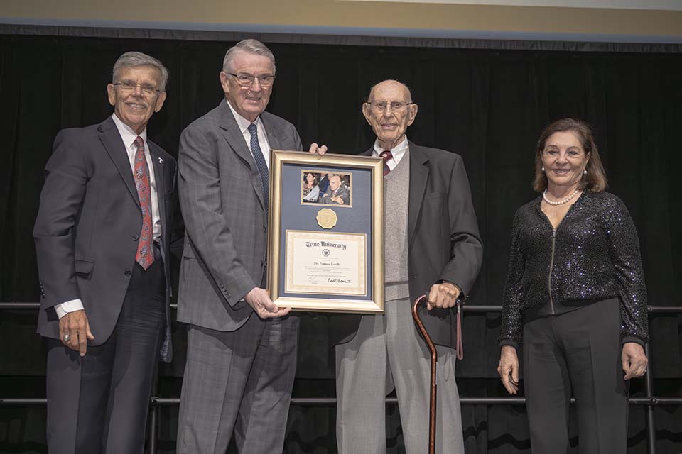 Dr. Brooks, Dr. James holding framed certificate, Dr. Furth and Ema Furth