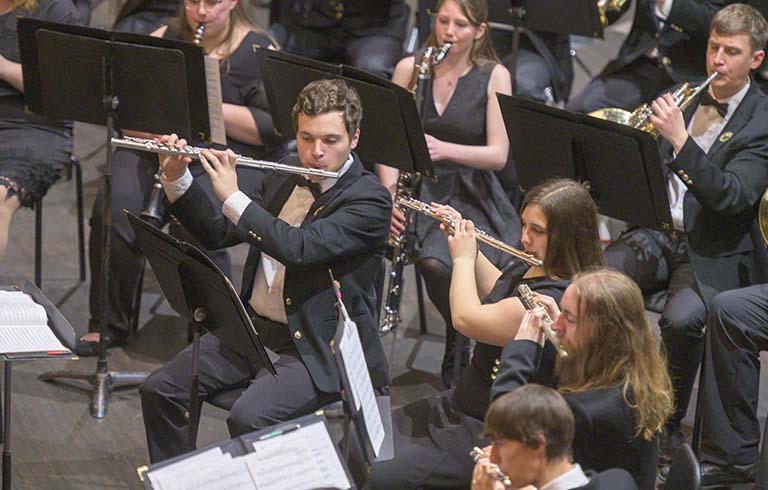 Wind ensemble members performing